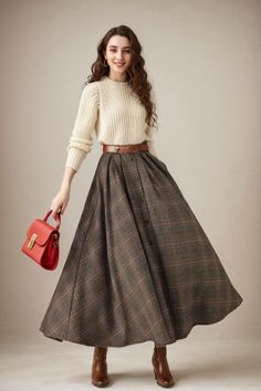 This winter wool skirt is a classic piece of tailoring that will see you through rain or shine. It is cut with a flattering flared skirt to give you a wonderful shape. The winter skirt is perfect classic styling and ends at the ankle. This is a versatile skirt that you'll wear again and again. DETAILS: * 30% wool, 30% fiber, 40% polyester * fully satiny liner * Two side pockets * Buttons closure * has belt loops to keep everything in place  * Plus size full skirt * Ankle length skirt * Perfect for Winter, autumn MODEL SIZE Bust 85 cm(33.4") Waist 67 cm(26.7") Height 168cm (5' 6") She wears size XS SIZE GUIDE Size vary between Brand and Country Please get your body measurement with our Size Guide And Find your size in our Size Chart Size Guide https://etsy.me/3d3EmoM SIZE CHART  https://ets Classic Winter Outfits Classy, Wool Long Skirt, Womens Winter Skirt Outfits, Vintage Inspired Outfits Casual, Winter Wardrobe Aesthetic, Autumn Long Skirt Outfit, What To Wear With Long Skirts, Korean Style Dress Elegant, Long Winter Skirts