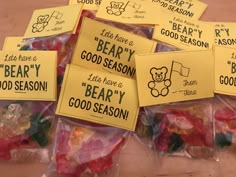 there are many gummy bears in bags on the table and one is saying beary good season