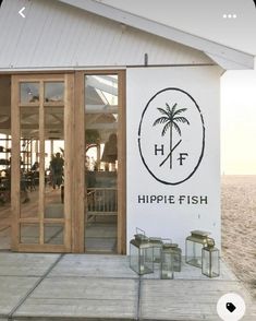 a sign that says hippie fish on the side of a building with glass doors