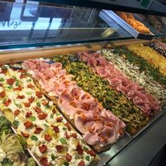 a display case filled with lots of different types of food