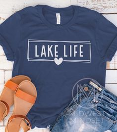 Lake Life Shirt, Womens Lake TShirt, Vacation Shirts, Camper Shirt, Lake Vibes Shirt, Mothers Day Lake, Cabin Sweatshirt, Beach T Shirt Bella Canva 3001T:  T-Shirt Sizing Please reference the size chart before selecting shirt size.  Use one of your own t-shirts to measure the size and fit.  Then compare with the size chart provided to ensure an accurate fit. T-Shirt Materials 100% combed and ring-spun cotton. Heather colors are 90% combed and ring-spun cotton, 10% polyester. Pre-shrunk fabric. S Summer Shirt With Screen Print For Outdoor Activities, Summer Outdoor Shirt With Screen Print, Summer Crew Neck Shirt For Camping, Summer Camping Tops With Letter Print, Summer Camping Top With Letter Print, Blue Cotton Tops For Camping, Casual Text Print Top For Camping, Casual Top With Text Print For Camping, Summer Camping Shirt With Letter Print