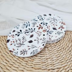 two plates sitting on top of a woven basket