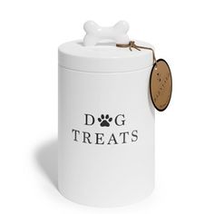 a white dog treat jar with a brown tag