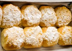 powdered sugar covered pastries in a box