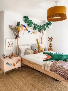 a child's bedroom decorated in white and green