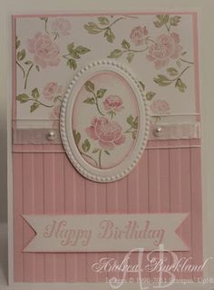 a pink and white birthday card with flowers on the front, happy birthday to you