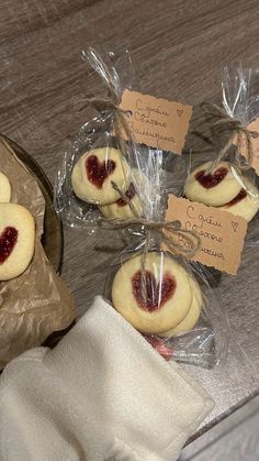 some cookies wrapped in plastic and sitting on a table