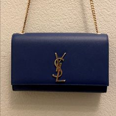 Excellent Condition, Rarely Used. Looks New, No Damage Or Scratches Inside Or Out. A Structured Silhouette Of Rich Grained Leather Adjustable Chain Shoulder Strap, 19" Drop 9.5"W X 6"H X 2"D Snap Flap Closure Goldtone Hardware One Inside Open Pocket Fully Lined Leather Dust Bag Included Blue Saint Laurent Bag, Bags Ysl, Ysl Handbags, Salvatore Ferragamo Handbags, Chambray Denim Shirt, Ferragamo Handbags, Medium Handbags, Yves Saint Laurent Bags, College Bags