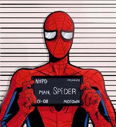 a spider man holding up a sign in front of a muggy mugshoter