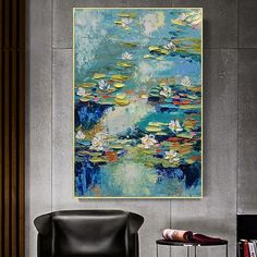 a painting hanging on the wall above a chair