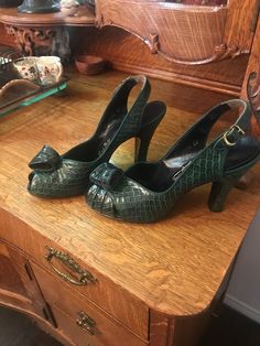 These amazing shoes have never been worn!!... They are an exquisite pair of vintage green croc, high heels, sling back  shoes in excellent condition as you can tell by the pictures... They come in their original box which is a bit frail .. They are size 71/2 narrow The heel is slightly above 3'' They are the epitomy of elegance Circa: late 40's early 50's I bought these at the Santa Monica Antique show in CA, in 2010 from this dealer who had the most amazing collection of fashion items from the same era.I bought a few articles from her that are also in pristine condition, that i will be listing at a later date. Sling Back Shoes, Back Shoes, Laguna Niguel, Antique Show, Womens Pumps, Sling Back, Fashion Items, Santa Monica, Pump Shoes