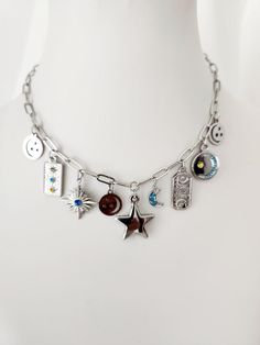 Multi Charm Silver Necklace | Stars, Sun and Moon Necklace | Stainless Steel | Celestial Necklace | Gift for Her | Bohemian and Trendy Necklace | Cosmic and Tarot Necklace | Necklace for Witches Immerse yourself in the magic of the cosmos with this Multi Charm Silver Necklace. Designed for lovers of the night sky, this stainless steel necklace features star, sun and moon charms, capturing the essence of the universe in a stylish and meaningful piece of jewelry. Perfect as a gift for her, this ce Metal Star Charm Pendant Necklace, Silver Celestial Charm Necklaces For Everyday, Silver Celestial Charm Necklace For Everyday, Celestial Pendant Charm Necklace In Metal, Celestial Pendant Charm Necklace, Celestial Metal Pendant Charm Necklaces, Silver Celestial Charm Necklace With Star Charm, Cosmic Necklace, Tarot Necklace