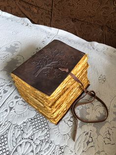 a stack of books sitting on top of a table next to a pair of glasses