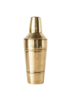 a brass colored cocktail shaker on a white background