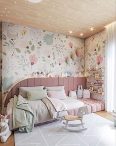 a child's bedroom decorated in pastel colors