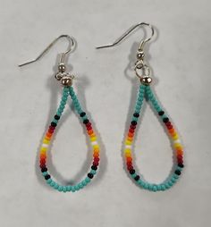 Lightweight beaded earrings that is very versatile. Adjustable Southwestern Beaded Earrings With Ear Wire, Turquoise Dangle Earrings With Large Beads, Adjustable Turquoise Earrings With Large Beads, Southwestern Beaded Dangle Earrings, Southwestern Style Beaded Dangle Earrings, Teardrop Tiny Beads For Jewelry Making, Southwestern Style Dangle Jewelry With Colorful Beads, Southwestern Style Colorful Beads Dangle Jewelry, Southwestern Style Colorful Beaded Dangle Jewelry