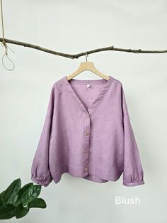 Seamless combination of Long sleeves, V-neck  and boyfriend shirt. This blousing blouse is very versatile. Tucked in, you got the vintage look with its V-neck; un-tucked, you look young and relaxed with the slightly puffed sleeves.  Either way, you just look elegant in and out.  -100% linen construction  -V-neck blouse -Buttoned front   -Long sleeves, loose sleeves -Buttoned cuff -High-low hem -Boxy silhouette  Please provide your shoulder width, full bust measurement ( measured around the fulle Oversized V-neck Shirt For Summer, Linen V-neck Shirt, Solid Linen V-neck Shirt, V-neck Linen Blouse For Work, Cotton V-neck Shirt In Solid Color, V-neck Cotton Blouse, Cotton V-neck Blouse, Relaxed Fit V-neck Blouse For Fall, Cotton V-neck Solid Color Blouse