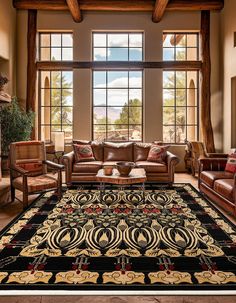 a living room filled with furniture and a large rug on top of a floor next to a window