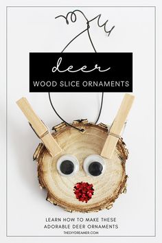 an ornament made to look like a tree slice with a face on it