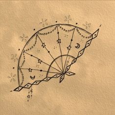 a drawing of a fan with stars and moon designs on it's back side