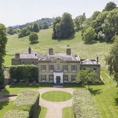 an aerial view of a large house in the countryside