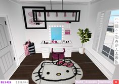 a hello kitty rug is in the middle of a room with a vanity and mirror