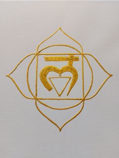 the symbol for love is drawn in gold on white paper