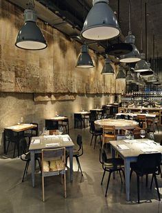 an empty restaurant with several tables and chairs