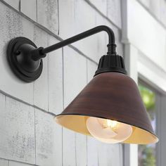 an outdoor light on the side of a building