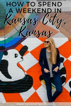 a woman standing in front of a mural with the words how to spend a weekend in kansas city, kansas