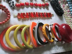 Beautiful vintage lot from 1940s - 1980s plastic Bakelite Lucite, sterling Lucite Faux pearls  and Celluloid jewelry all in good vintage condition. You will find 36 bracelets, 1 belt, 12 necklaces, 9 pair of earrings, 1 fur clip, 1 ring, and 6 brooches with some signed pieces such as Design by Paula, Meriam Haskell, Coro, Lisner, Monet, Avon and more. Due to the size of the lot all sales are final. Adjustable Retro Jewelry, Retro Bakelite Jewelry As Gift, Retro Handmade Bangle Jewelry, Handmade Retro Bakelite Jewelry, Vintage Multicolor Bracelets, Retro Multicolor Round Jewelry, Elegant Bakelite Bracelet Jewelry, Red Retro Bangle Jewelry, Multicolor Round Retro Jewelry