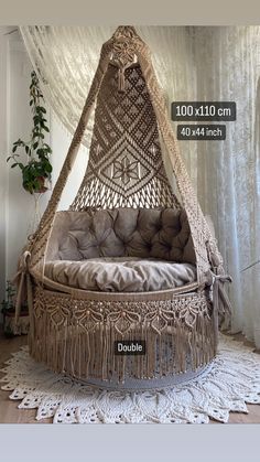 an image of a hammock bed in the middle of a room with curtains