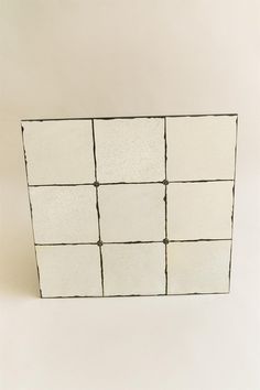 a white box with nine squares on it