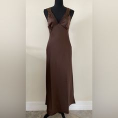 Material: 97% Poly 3% Spandex Approx Measurements Laying Flat Pit To Pit 15" Waist 14" Length 50" Brown Fitted V-neck Slip Dress, Fitted Bias Cut Slip Dress, Fitted V-neck Satin Maxi Dress, Fitted Satin Maxi Dress With V-neck, V-neck Stretch Satin Midi Dress, Fitted V-neck Midi Dress With Bias Cut, Fitted Satin Sheath Maxi Dress, Fitted Long Brown Dress, Fitted V-neck Bias Cut Slip Dress