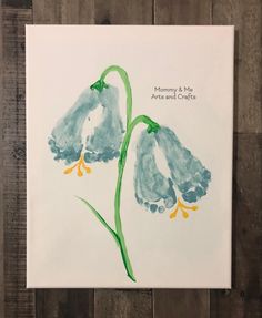 a card with two blue flowers painted on it