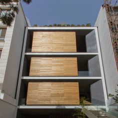 an apartment building with stairs leading up to it