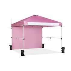 a pink and white tent sitting on top of a white floor