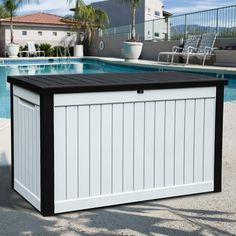 an outdoor storage box next to a swimming pool