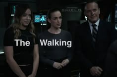 three people standing next to each other with the words'the walking'in front of them