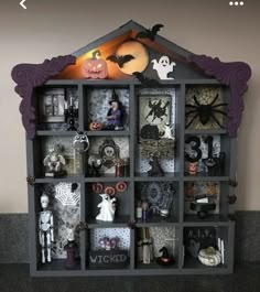 a book shelf with halloween decorations on it