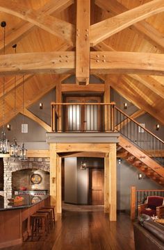 the inside of a house with wood floors and wooden beams on the ceiling is shown