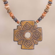 Signifying a union between the spiritual and the corporeal a pre-Hispanic chakana cross in yellow is crafted of ceramic to center this necklace from Peru. Dina designs the necklace adorning the wearer with earth-tone ceramic and gold-tone beads closing with a fold-over clasp of sterling silver. Ceramic Pendant Necklace, Necklace Sun, Travel Necklace, Beaded Pendant Necklace, Ceramic Pendant, Lovely Necklace, Ceramic Jewelry, Women Artisans, Ceramic Beads