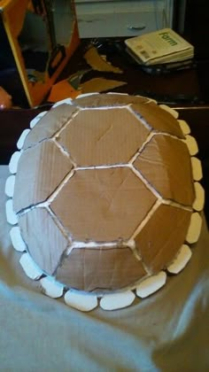 a cake that has been made to look like a tortoise shell on a table