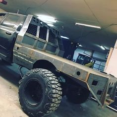 a large truck parked inside of a garage