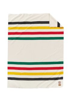 a white blanket with multicolored stripes on the front and back, folded up