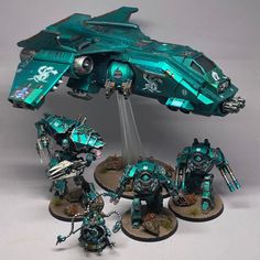 the warhammers are painted in teal and silver