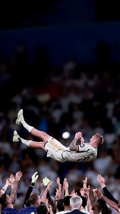 a man flying through the air while riding on top of another man