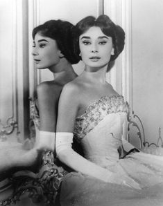 an old photo of two women in evening gowns, with the caption beverly hills hotel 100th anniversary