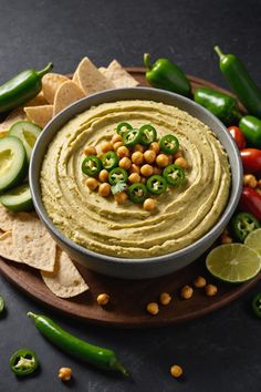 A photo of a  Jalapeño Hummus which is a type of hummus bowl Hummus From Canned Chickpeas, Spicy Avocado Hummus Recipe, How To Make Hummus From Dried Chickpeas, Jalepeno Hummus, Spicy Avocado Hummus