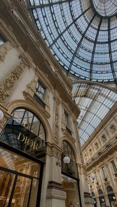 the inside of a building with glass roof